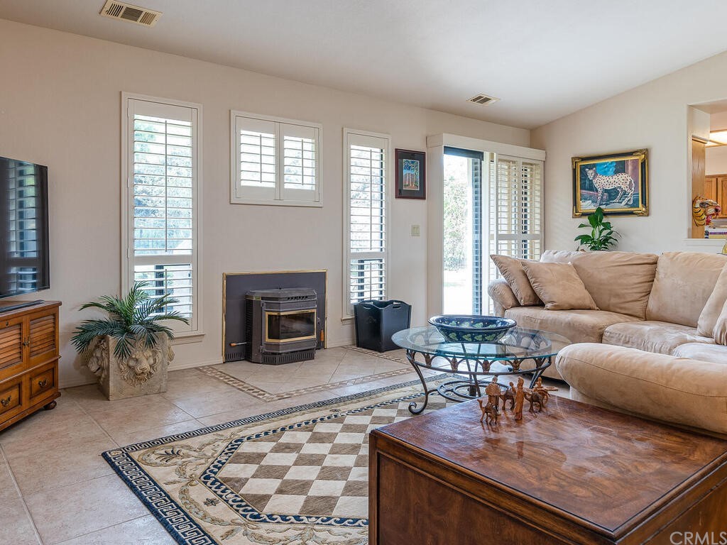 2715 Thoroughbred Place Arroyo Grande, CA 93420 - Photo 8 of 35 a living room with furniture and a fireplace