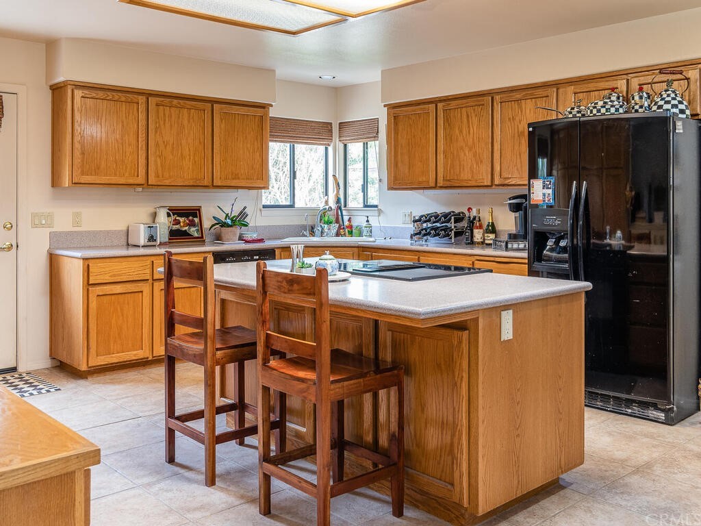 2715 Thoroughbred Place Arroyo Grande, CA 93420 - Photo 10 of 35 a dining table with chairs and wooden floor