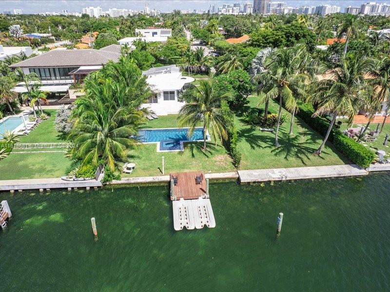 900 88th Street Surfside, FL 33154 - Photo 15 of 60 an aerial view of a house with a yard lake lake view and mountain view