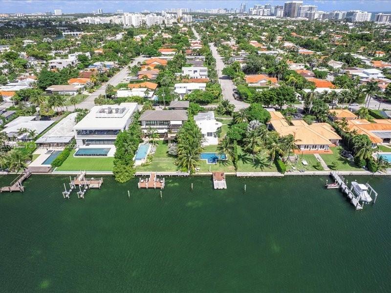900 88th Street Surfside, FL 33154 - Photo 16 of 60 an aerial view of residential houses with outdoor space and trees