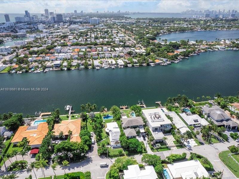 900 88th Street Surfside, FL 33154 - Photo 20 of 60 an aerial view of a house with a lake view