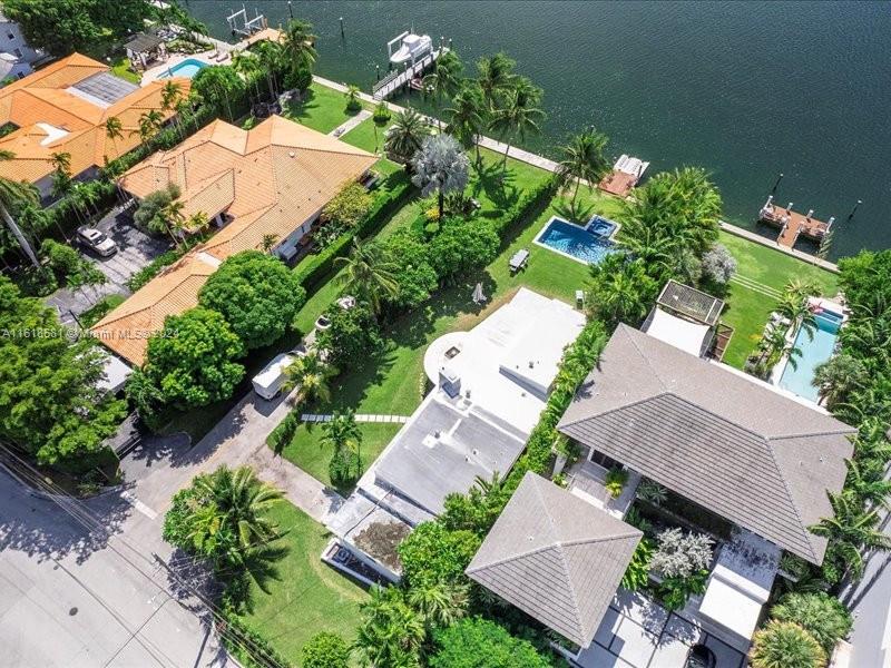 900 88th Street Surfside, FL 33154 - Photo 22 of 60 an aerial view of a house with a yard and garden