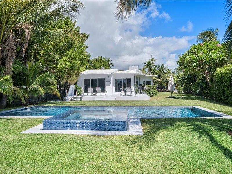 900 88th Street Surfside, FL 33154 - Photo 25 of 60 a view of house with a swimming pool