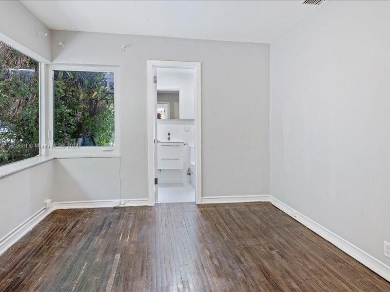 900 88th Street Surfside, FL 33154 - Photo 36 of 60 a view of wooden floor and windows in a room