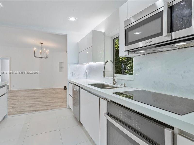 900 88th Street Surfside, FL 33154 - Photo 38 of 60 a bathroom with a sink and a bathtub