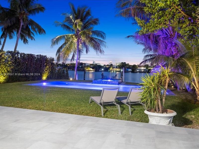 900 88th Street Surfside, FL 33154 - Photo 4 of 60 a view of yard with swimming pool and sitting area