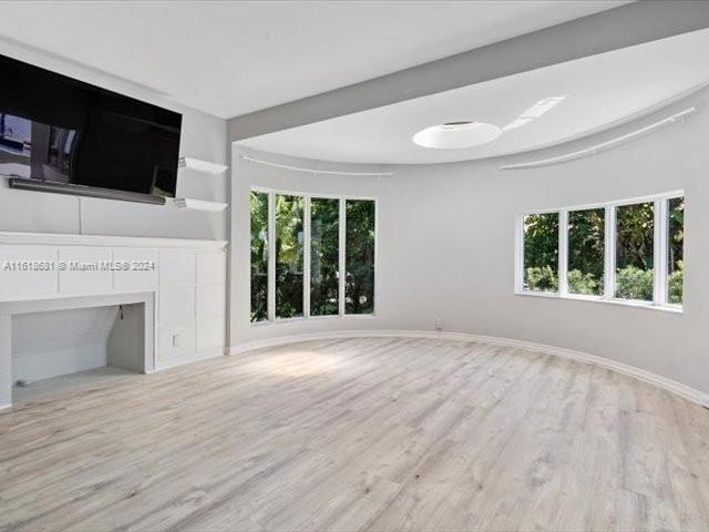 900 88th Street Surfside, FL 33154 - Photo 43 of 60 a view of a livingroom with an empty space and a fireplace