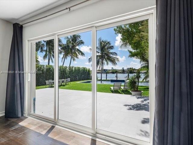 900 88th Street Surfside, FL 33154 - Photo 45 of 60 a view of a porch with a floor to ceiling window