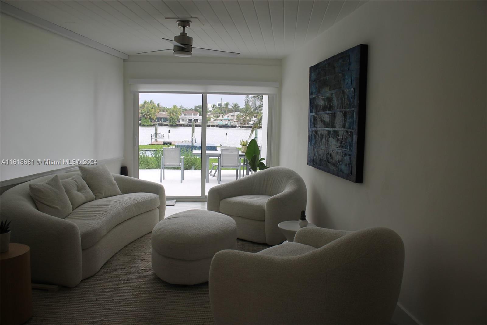 900 88th Street Surfside, FL 33154 - Photo 52 of 60 a living room with furniture and a large window