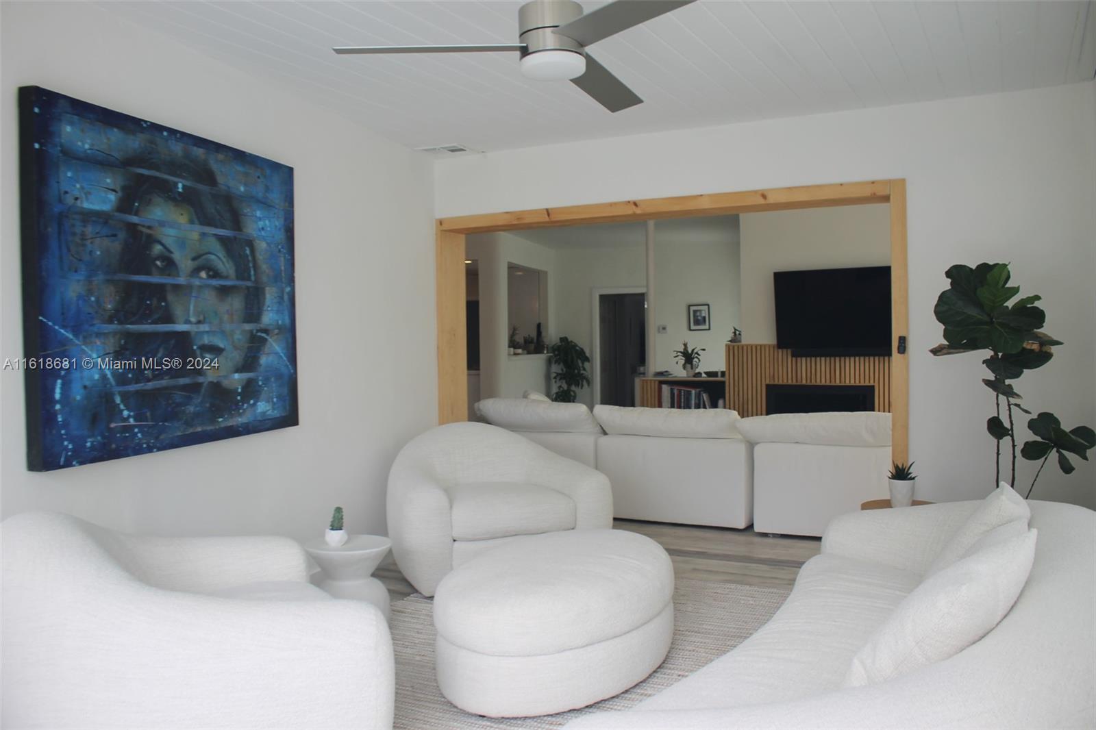 900 88th Street Surfside, FL 33154 - Photo 53 of 60 a living room with furniture and a flat screen tv