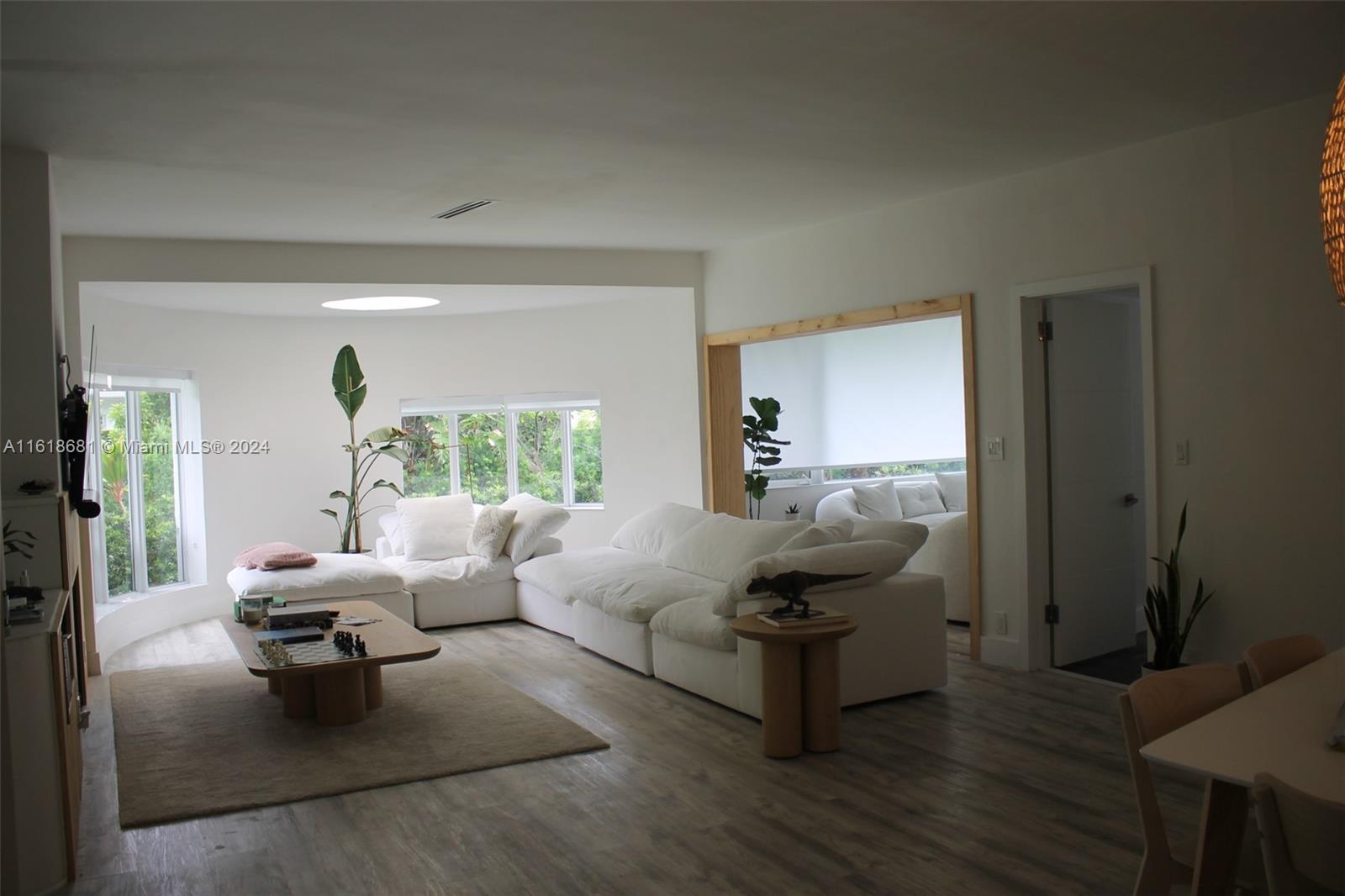 900 88th Street Surfside, FL 33154 - Photo 54 of 60 a living room with furniture rug and a large window