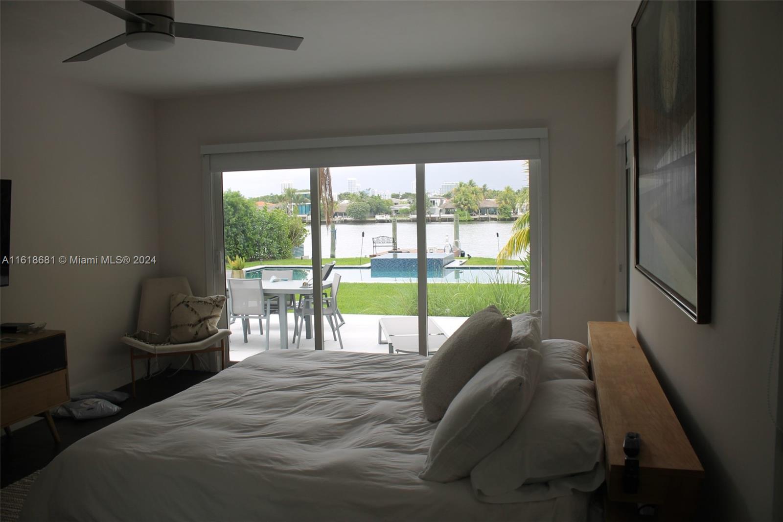 900 88th Street Surfside, FL 33154 - Photo 60 of 60 a bed sitting in a bedroom next to a window