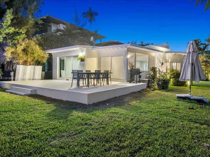 900 88th Street Surfside, FL 33154 - Photo 6 of 60 a view of a house with backyard and porch