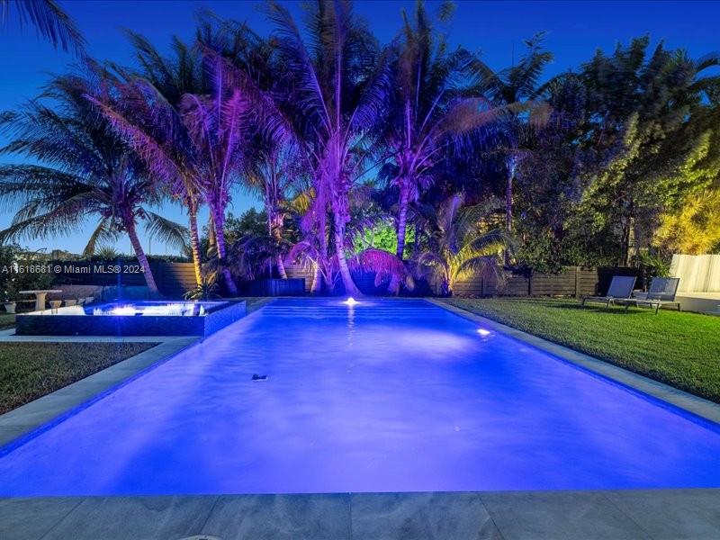 900 88th Street Surfside, FL 33154 - Photo 7 of 60 a view of yard with swimming pool and green space