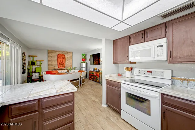 a open kitchen with stainless steel appliances granite countertop a stove and cabinets