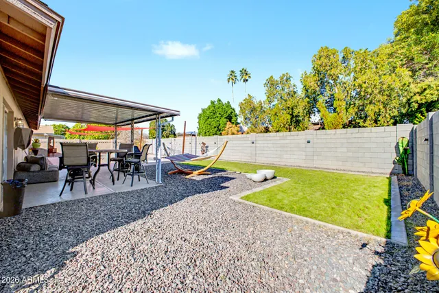 a view of swimming pool with outdoor seating and plants