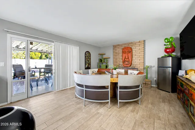 a view of a dining room with furniture window and wooden floor