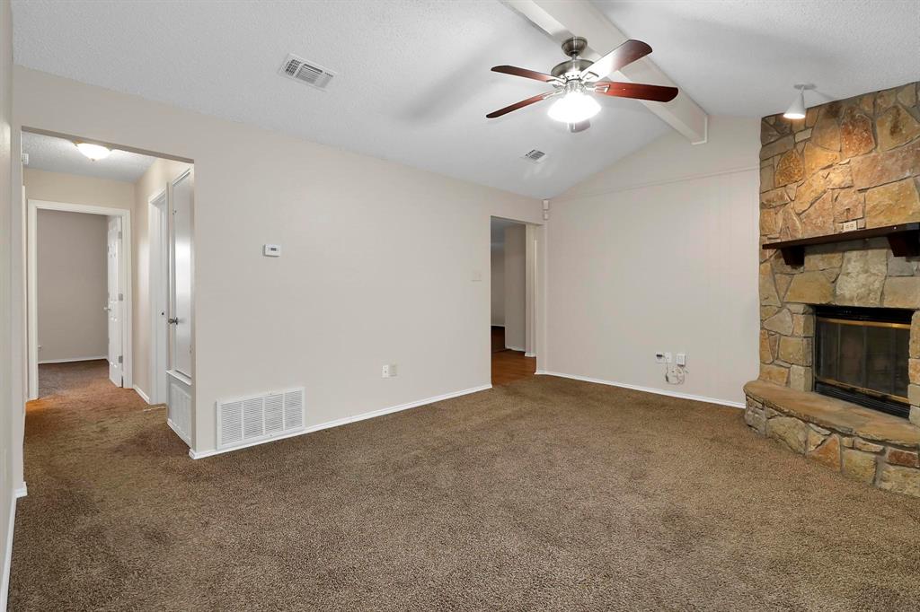 6632 Valley View Drive Watauga, TX 76148 - Photo 11 of 18 wooden floor in an empty room with a fireplace