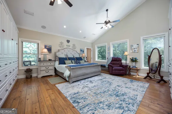 a white bath tub sitting in a bathroom next to a window