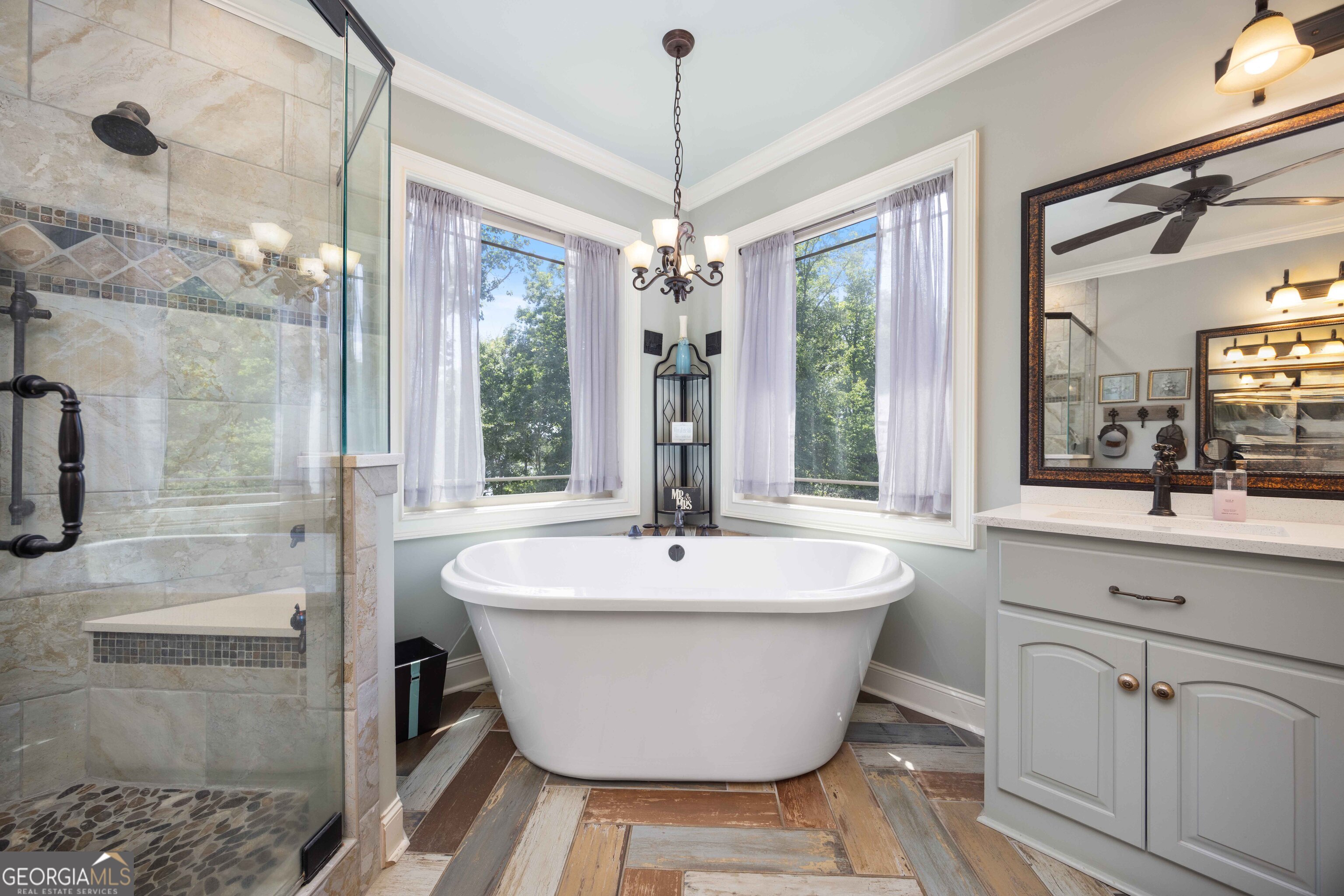 1132 Boat Club Road Hamilton, GA 31811 - Photo 17 of 50 a white bath tub sitting in a bathroom next to a window