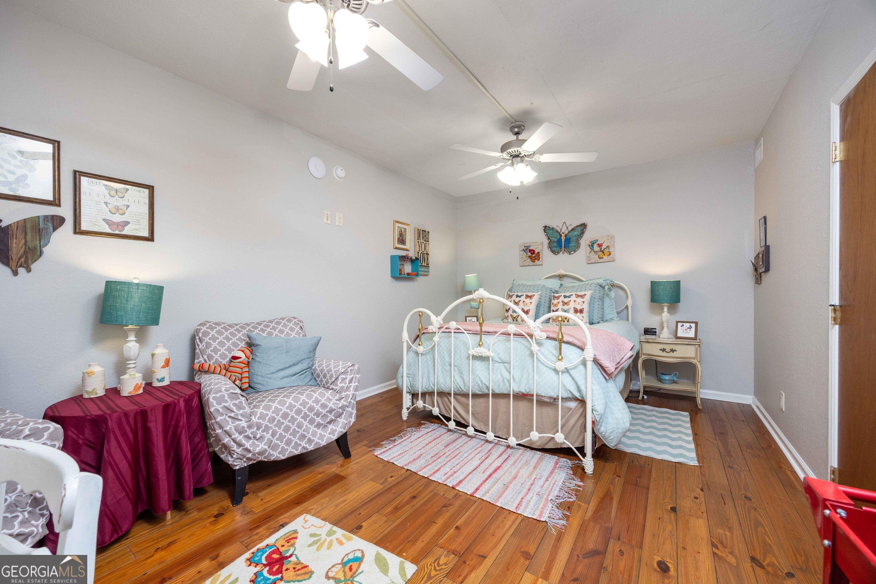 1132 Boat Club Road Hamilton, GA 31811 - Photo 19 of 50 a bedroom with furniture and a wooden floor