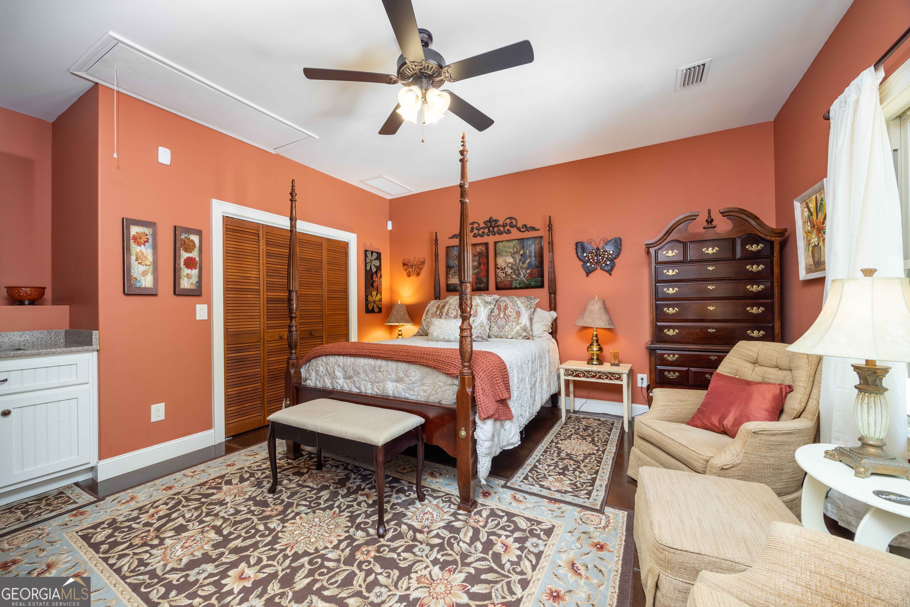 1132 Boat Club Road Hamilton, GA 31811 - Photo 20 of 50 a spacious bedroom with a bed a lamp and a rug