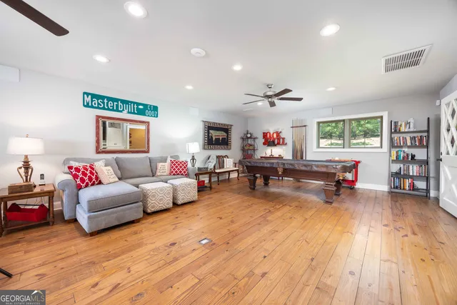 a living room with lots of furniture and a chandelier
