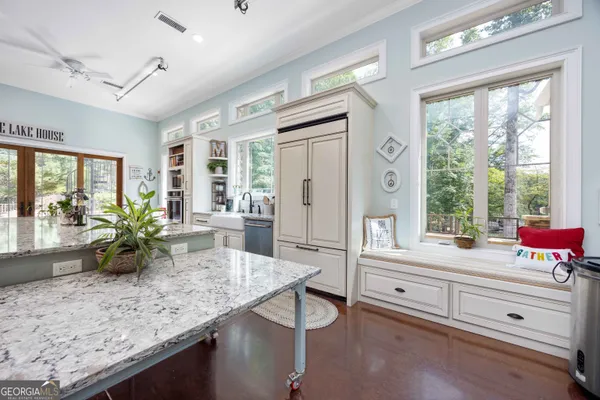 a dining table with chairs and window