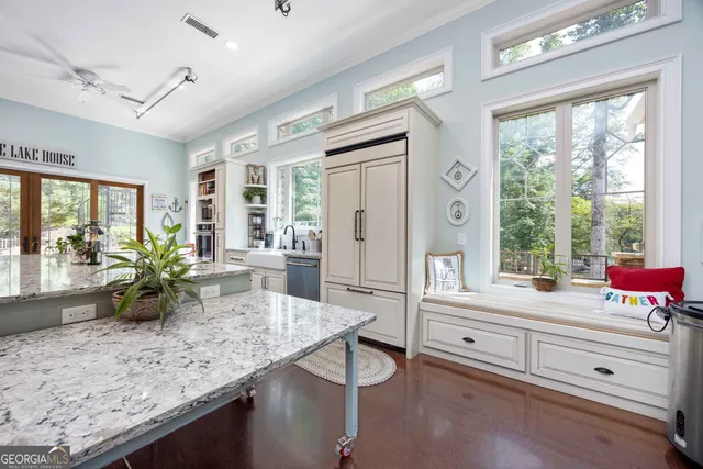 a dining table with chairs and window