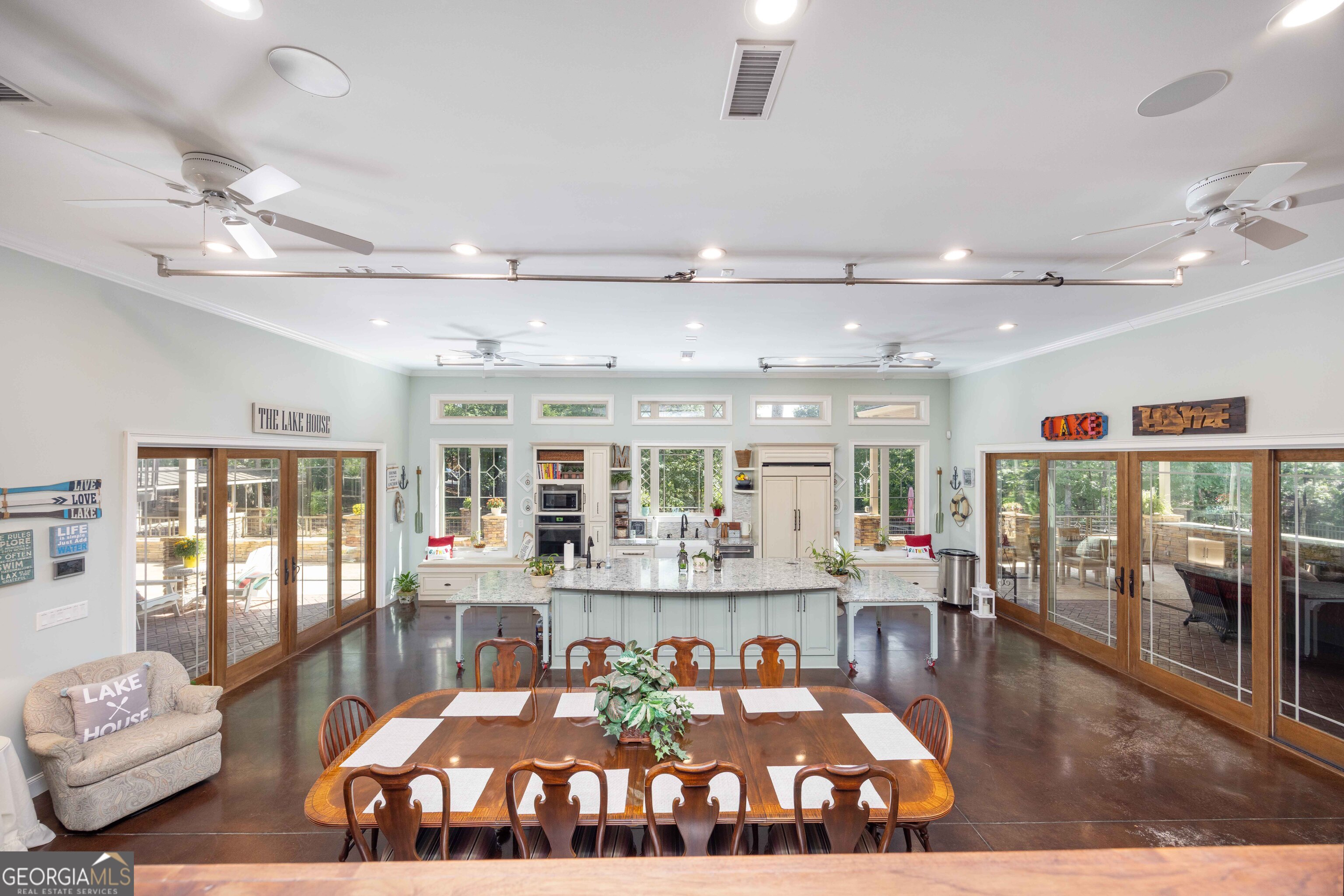 1132 Boat Club Road Hamilton, GA 31811 - Photo 30 of 50 a living room with lots of furniture and a chandelier