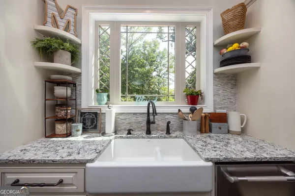 a view of a patio with a dining table and chairs