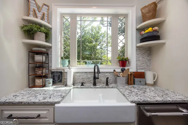 a view of a patio with a dining table and chairs