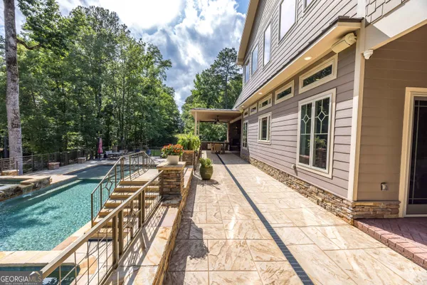 a view of backyard with seating area and trees