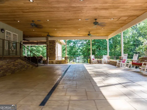 a view of a swimming pool with a patio