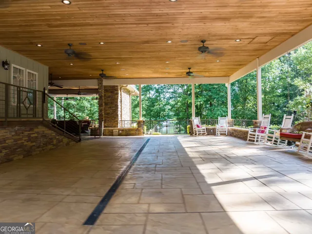 a view of a swimming pool with a patio