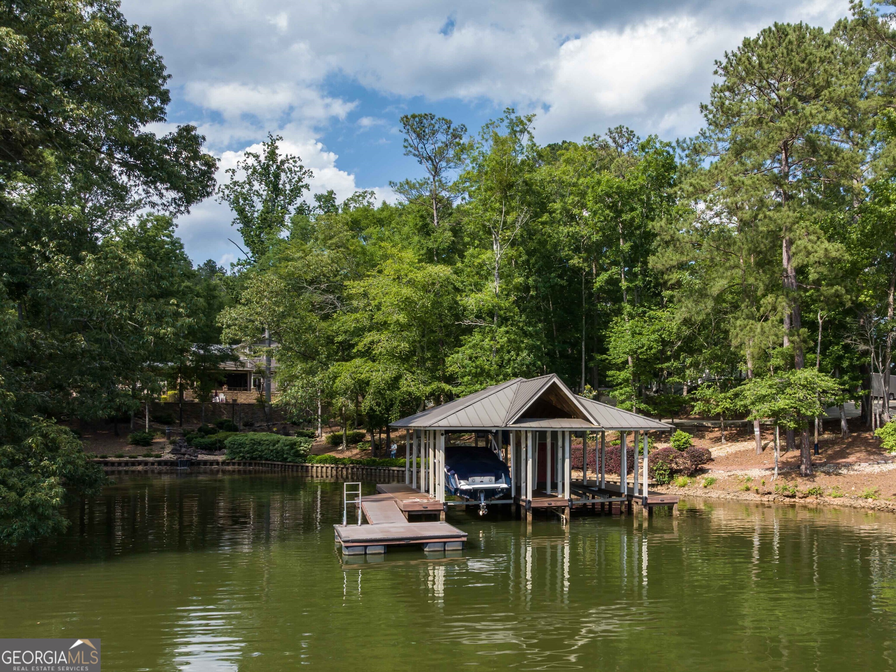 1132 Boat Club Road Hamilton, GA 31811 - Photo 4 of 50 a view of a lake with a house in the background