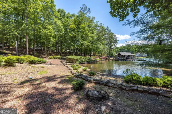a view of a lake with a yard