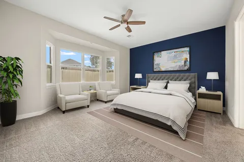 a view of a dining room with furniture and a window