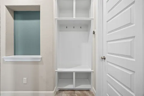 a bathroom with a sink toilet and a mirror