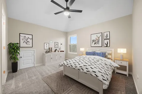a bathroom with a granite countertop sink a toilet and a mirror