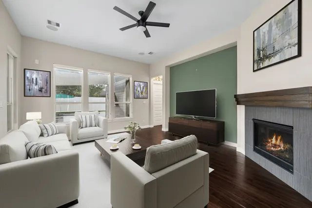a living room with furniture and a fireplace
