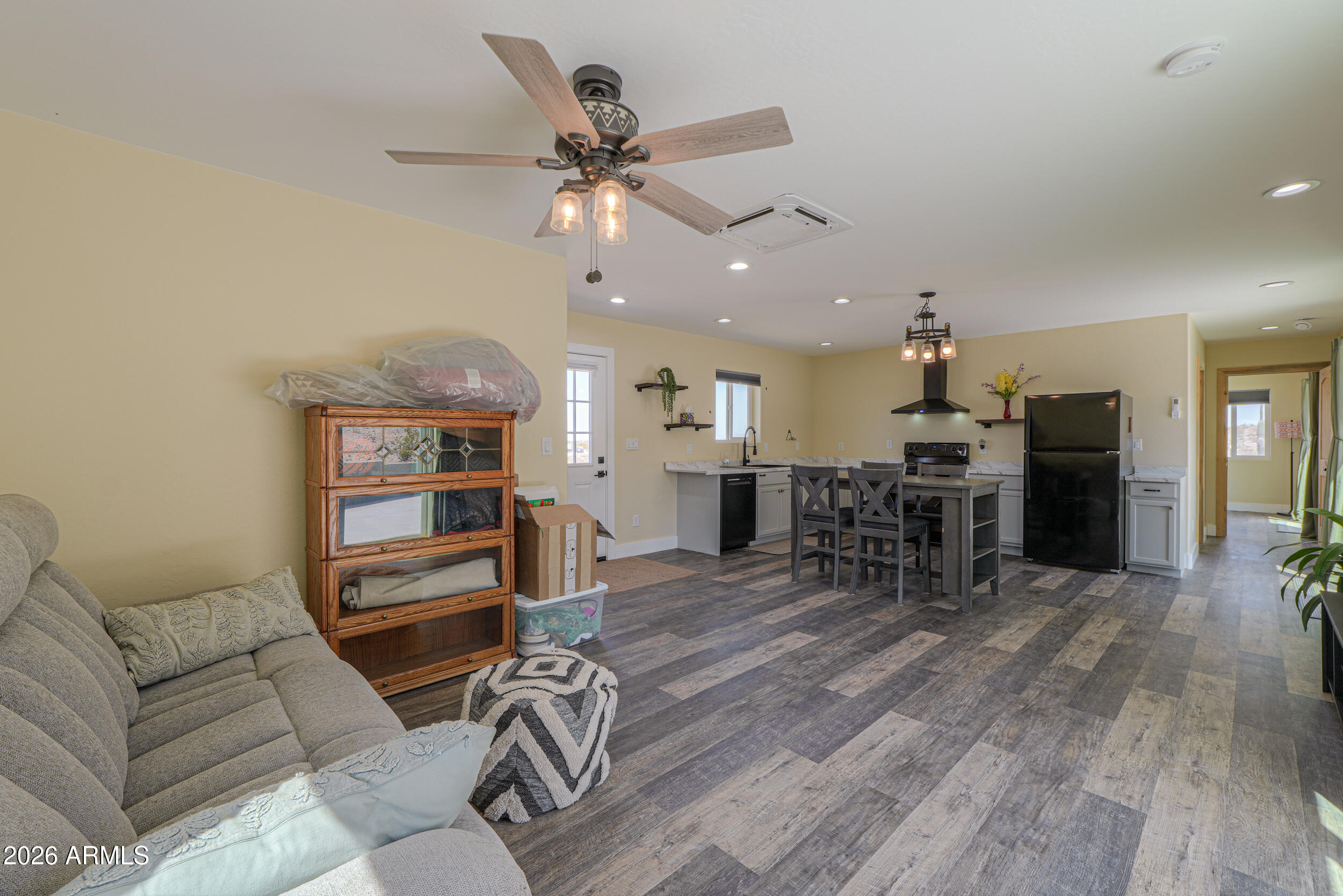 0 West Quail Run Road Maricopa, AZ 85139 - Photo 11 of 49 a living room with furniture and kitchen view
