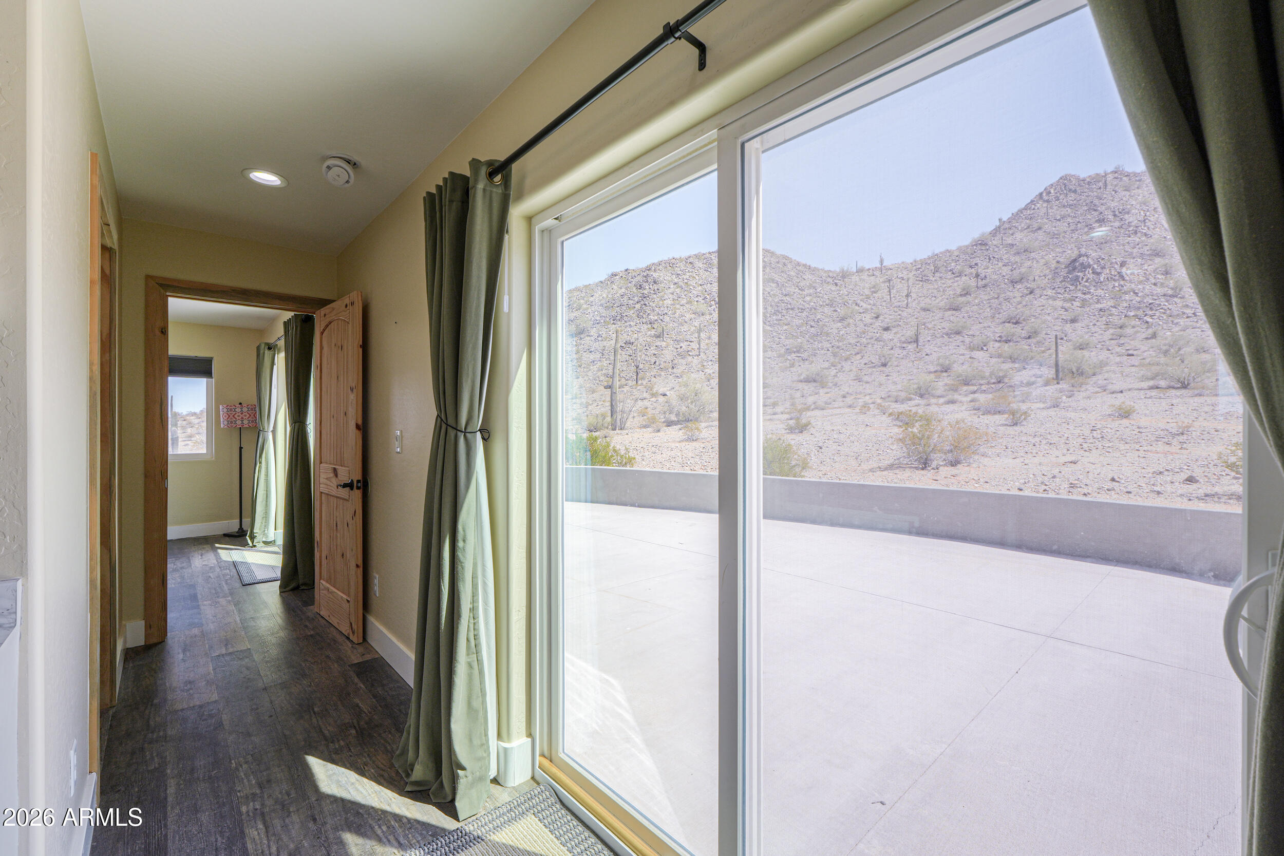 0 West Quail Run Road Maricopa, AZ 85139 - Photo 12 of 49 a view of a hallway with wooden floor and a living room