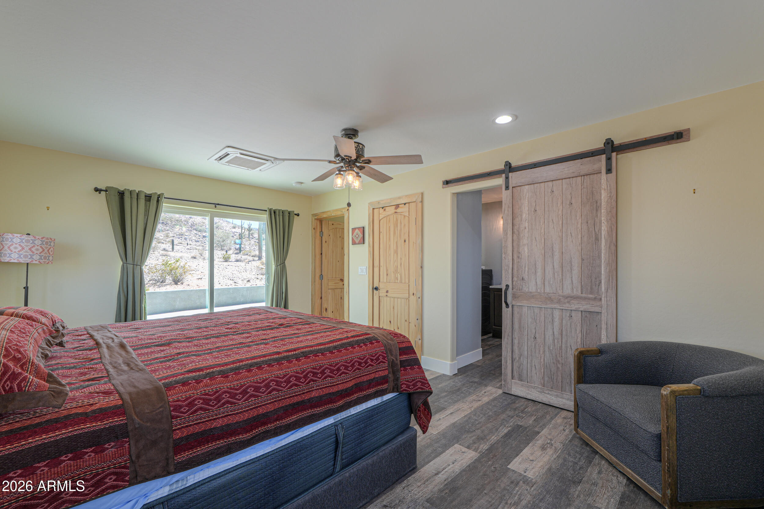 0 West Quail Run Road Maricopa, AZ 85139 - Photo 16 of 49 a bedroom with a bed couch and window