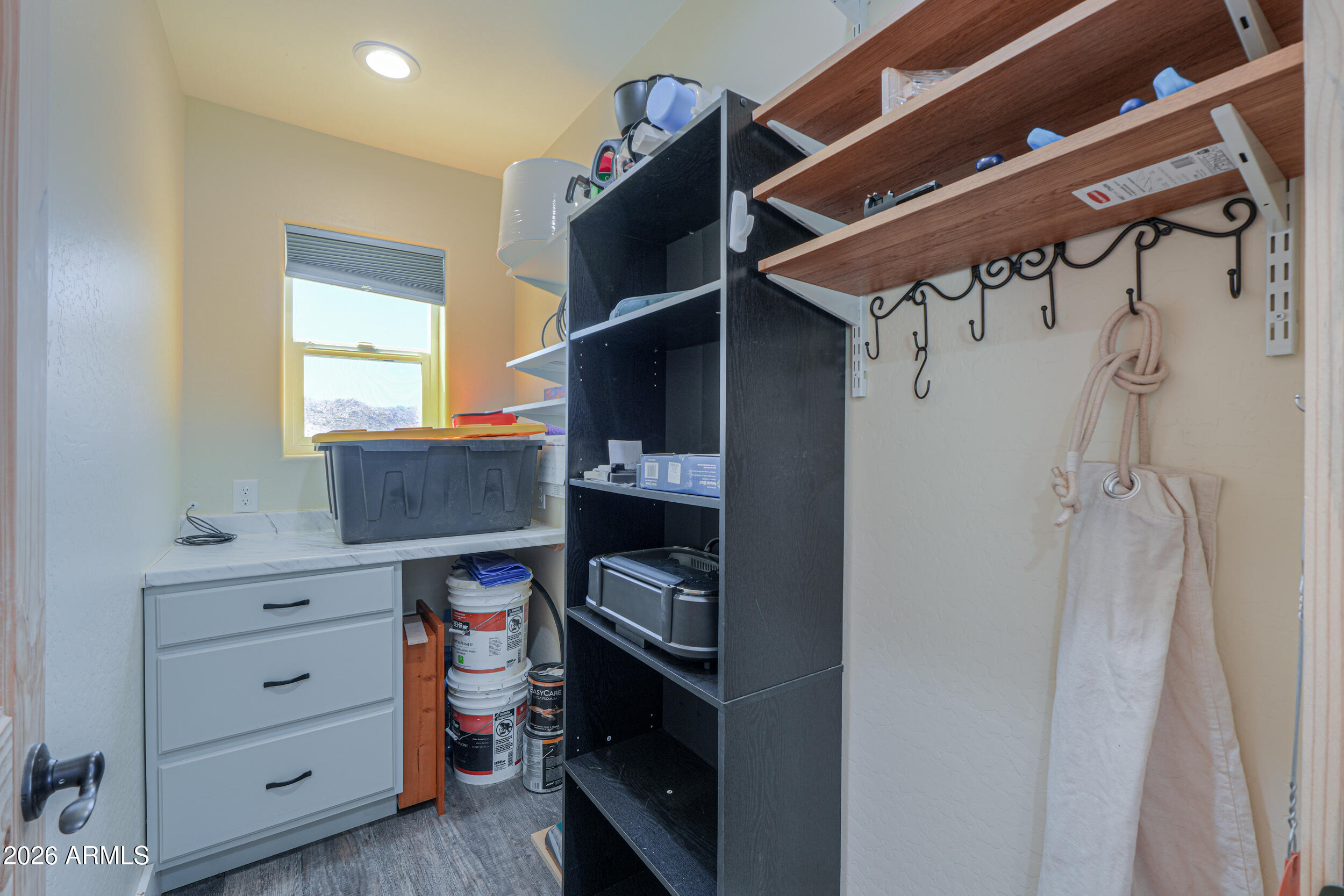 0 West Quail Run Road Maricopa, AZ 85139 - Photo 21 of 49 a view of walk in closet with clothes and shoes