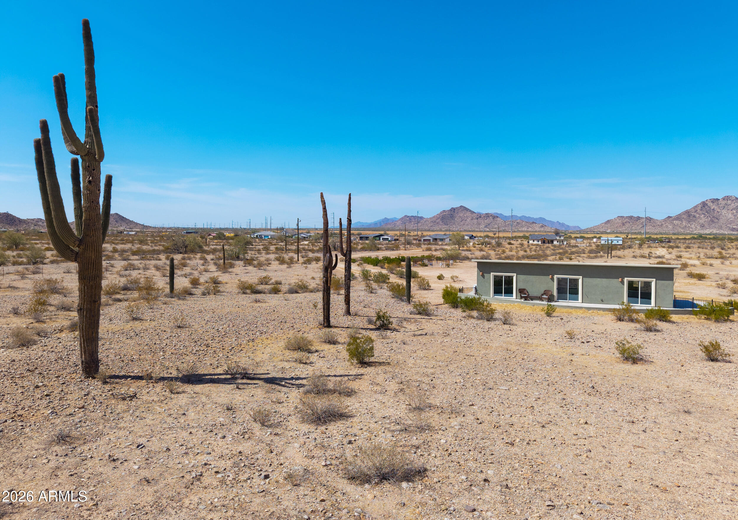 0 West Quail Run Road Maricopa, AZ 85139 - Photo 44 of 49 a view of a blue house with a yard