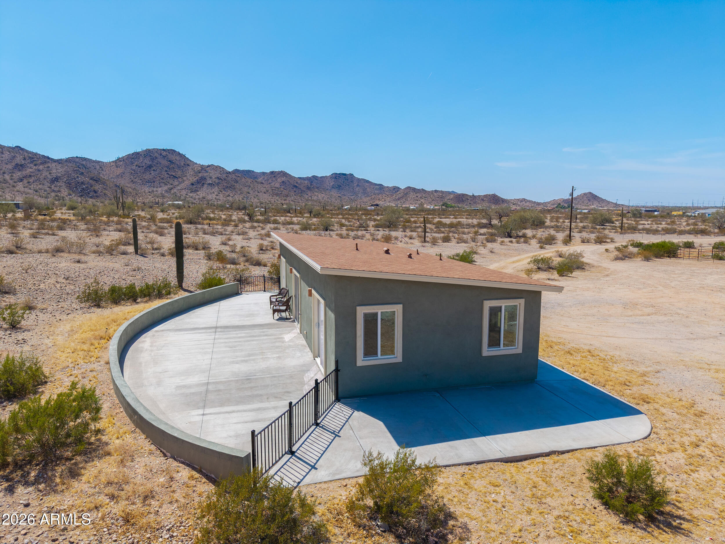0 West Quail Run Road Maricopa, AZ 85139 - Photo 45 of 49 a view of a terrace with a garden and mountain view