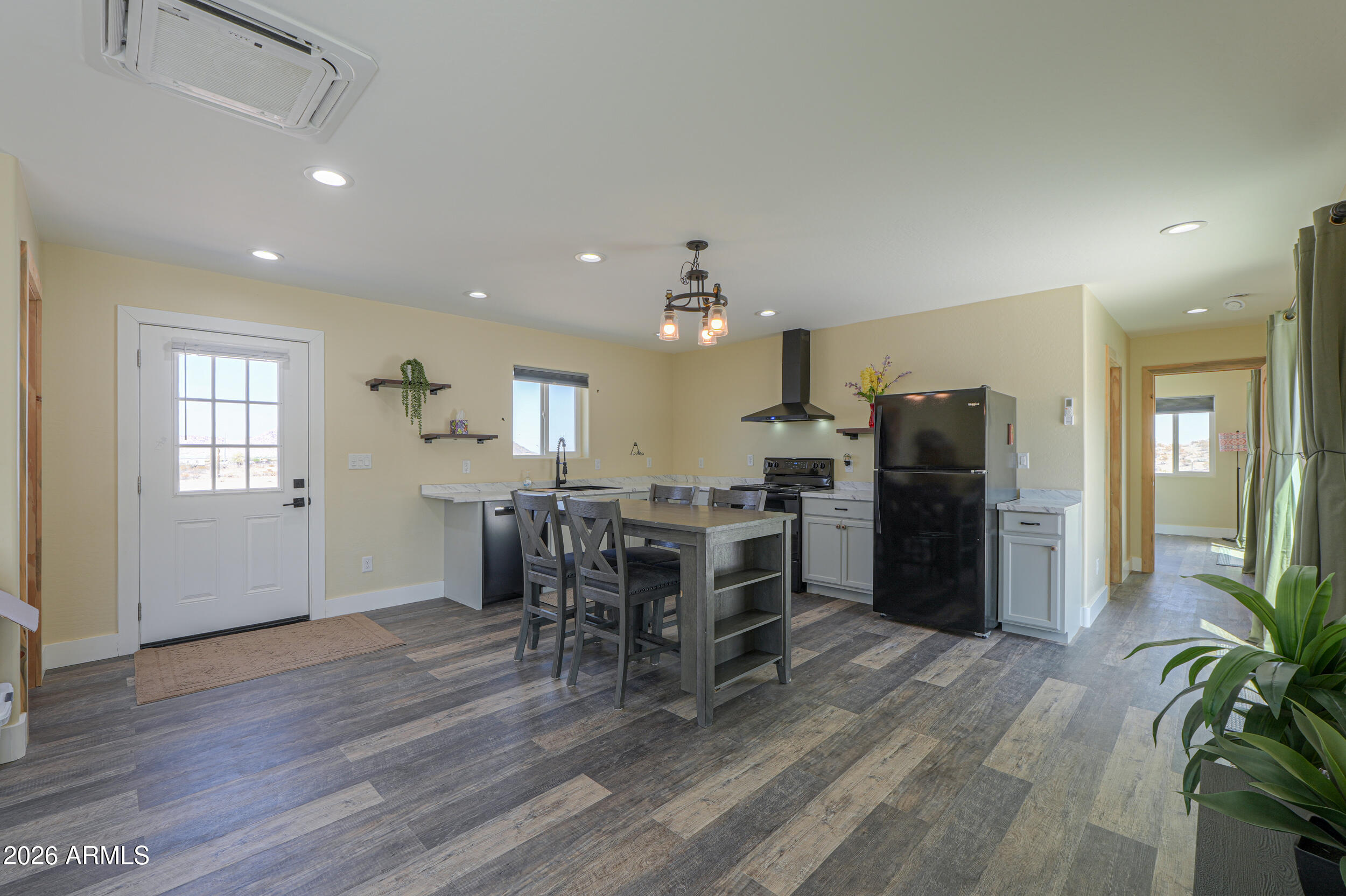 0 West Quail Run Road Maricopa, AZ 85139 - Photo 6 of 49 a view of a dining room with furniture window and wooden floor