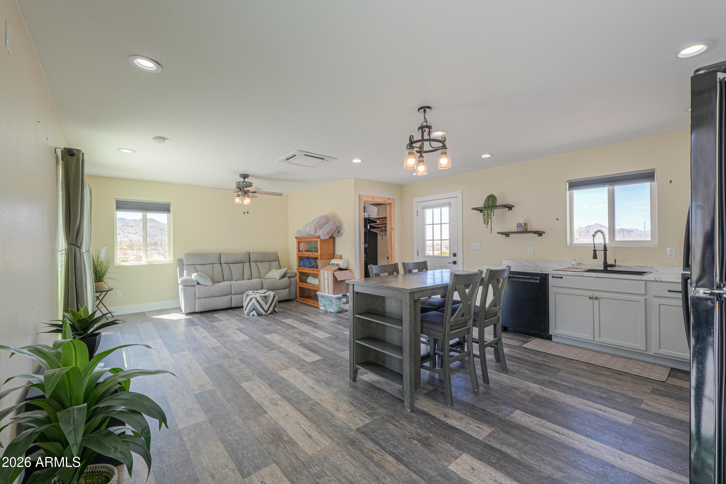 0 West Quail Run Road Maricopa, AZ 85139 - Photo 7 of 49 a view of a dining room with furniture and a chandelier