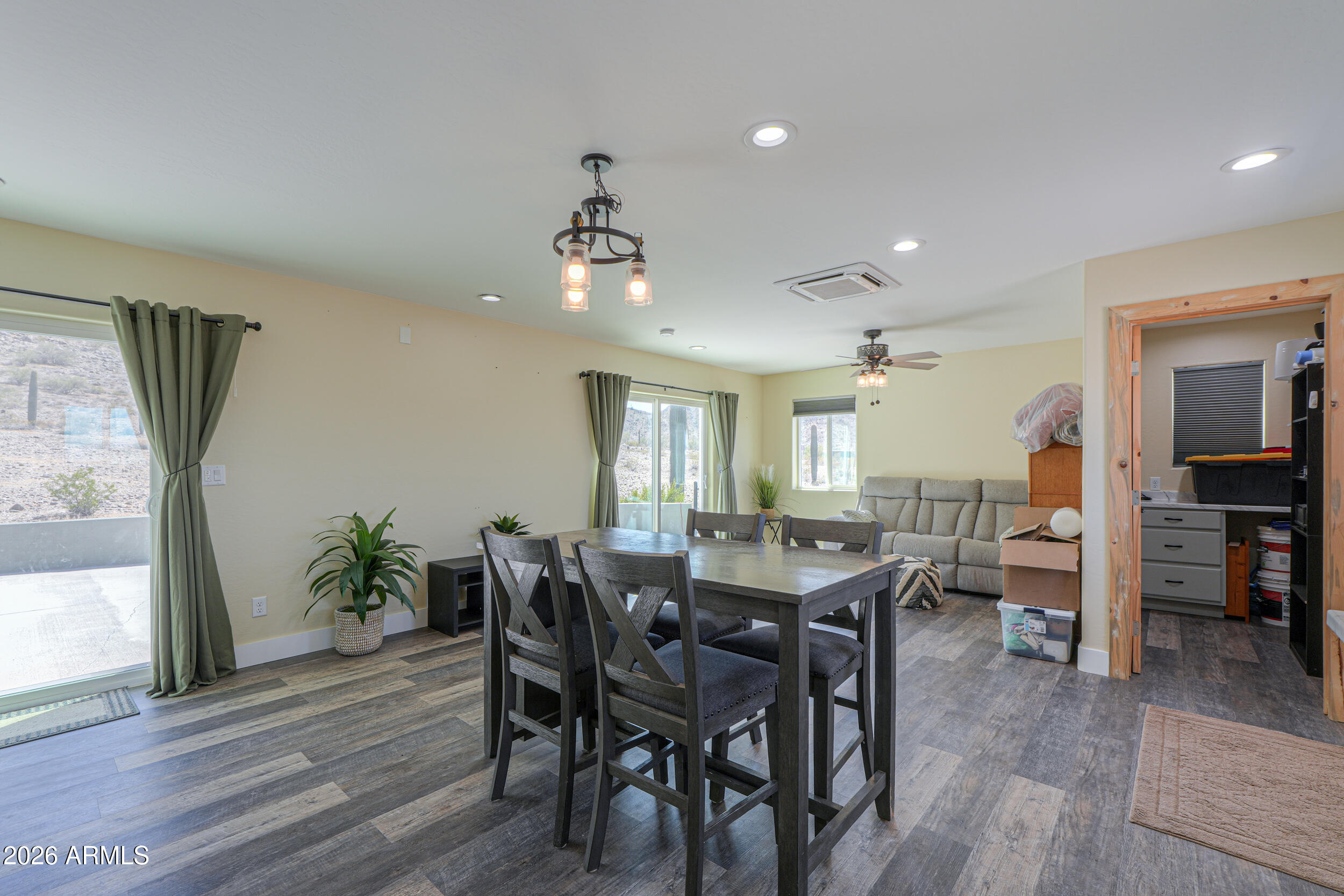 0 West Quail Run Road Maricopa, AZ 85139 - Photo 8 of 49 a view of a dining room with furniture and wooden floor